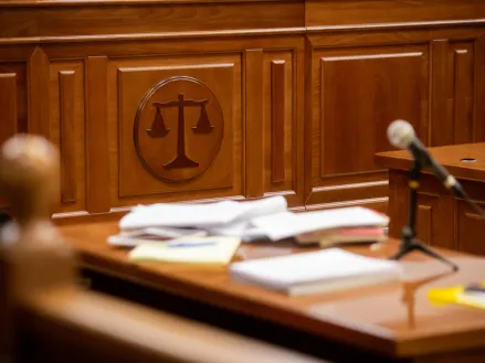 scales of justice sign in court room 